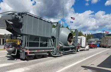 Oversized load transport with pilot car